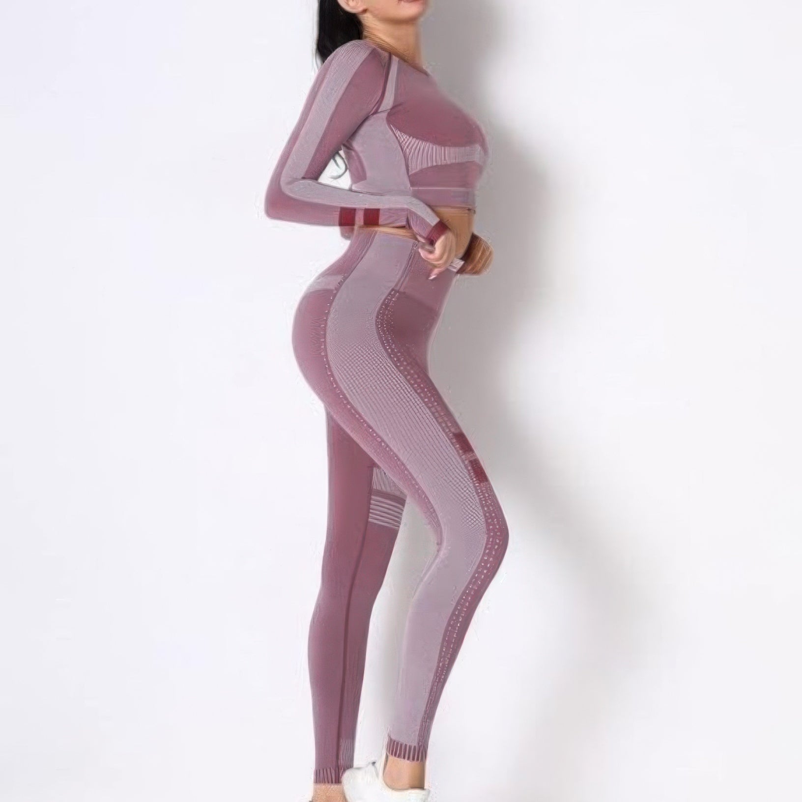 Seamless long sleeve yoga set in a stylish pink design, perfect for workouts and casual wear.