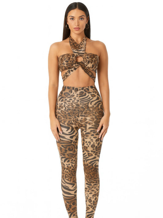 Model wearing the Leopard Cheetah Intertwined Set featuring a halter crop top and fitted leggings.