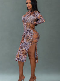 Leopard Cut Out Sexy Midi Dress showcasing a bold leopard print with daring side cut-outs and a sleek design.