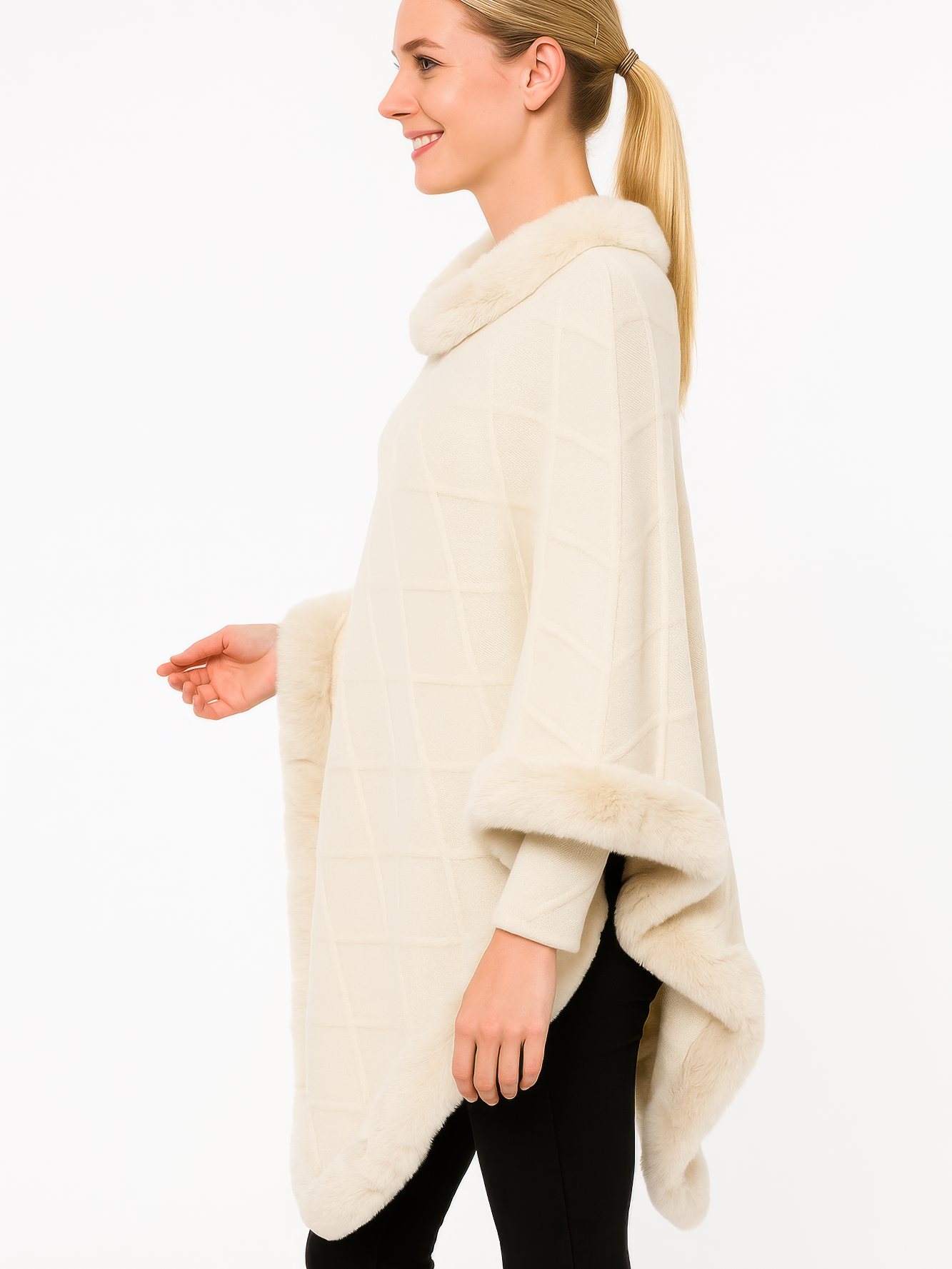 Classic Black Poncho With Faux Fur Trim displayed on a model from the side, showcasing its elegant design.