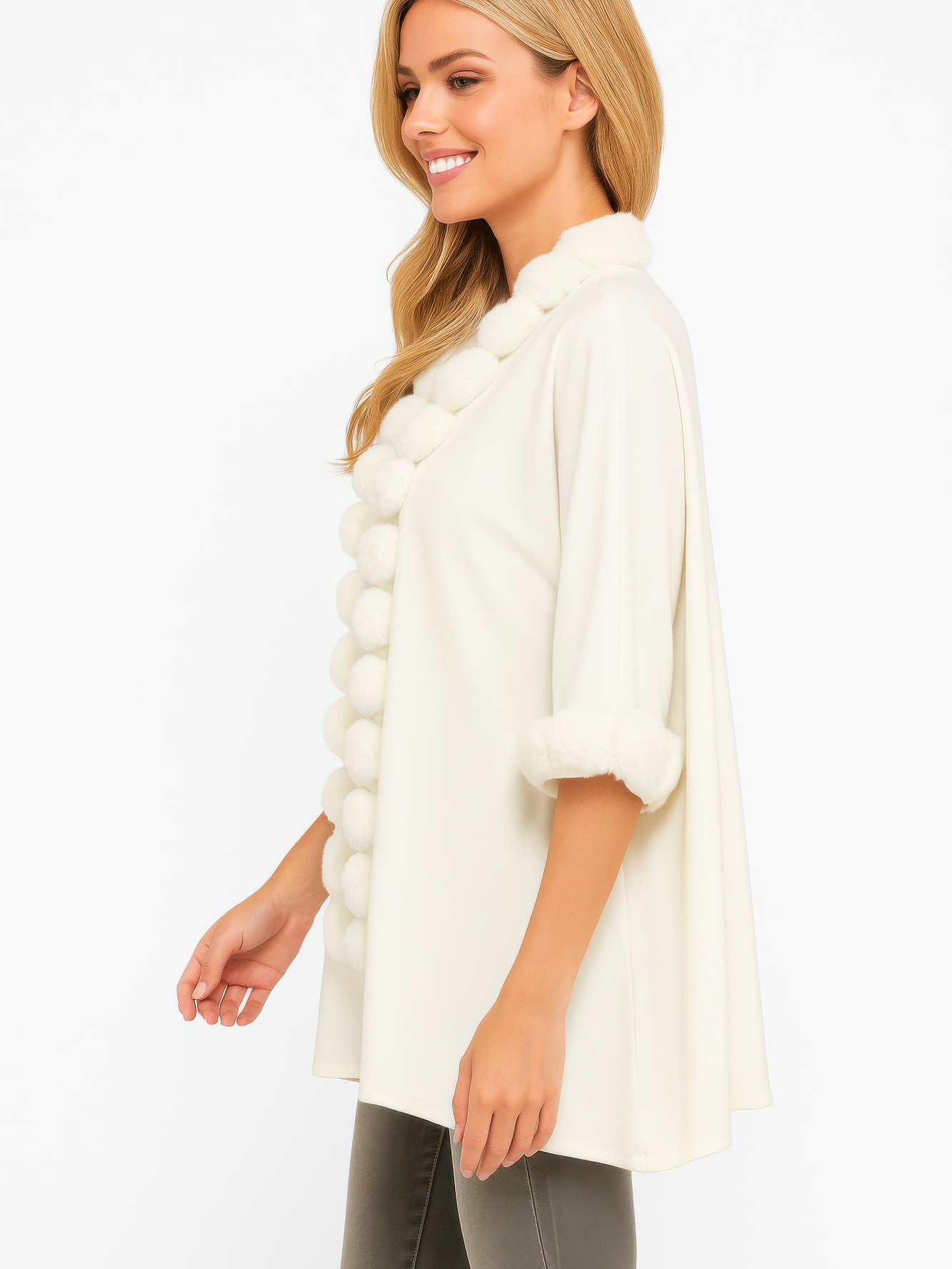 Open-Front Cape With Pom Faux Fur Trim modeled by a woman, featuring a plush trim and stylish silhouette.