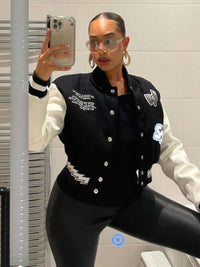 Varsity Patchwork Y2k Jacket styled with oversized sunglasses and hoop earrings in a mirror selfie.