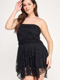Plus Size Ots Lace Overlay Assym Dress featuring a model in a black off-the-shoulder lace dress with a flowing skirt.