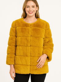 Model wearing a stylish Plush Camel Faux Fur Jacket with a clean silhouette and cozy texture.