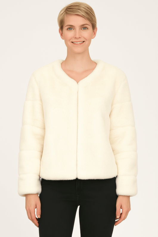 Model wearing a cream faux fur jacket, showcasing soft texture and stylish design in a neutral tone.