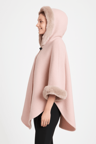 Hooded Faux Fur Trim Cape in soft pink, featuring a plush fur hood and stylish wide sleeves for elegant layering.