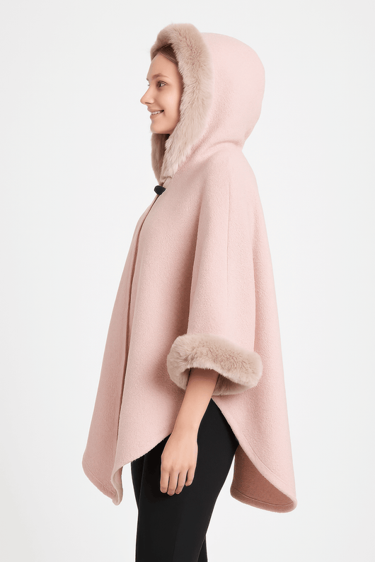 Hooded Faux Fur Trim Cape in soft pink, featuring a plush fur hood and stylish wide sleeves for elegant layering.