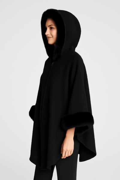 Hooded Faux Fur Trim Cape in black, featuring plush faux fur trim, a roomy hood, and wide sleeves for elegant warmth.