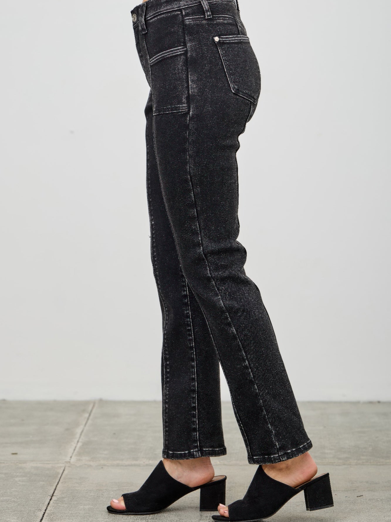 Mid Rise Slim Straight In Black Acid showcased on model, highlighting the sleek silhouette and black acid wash.