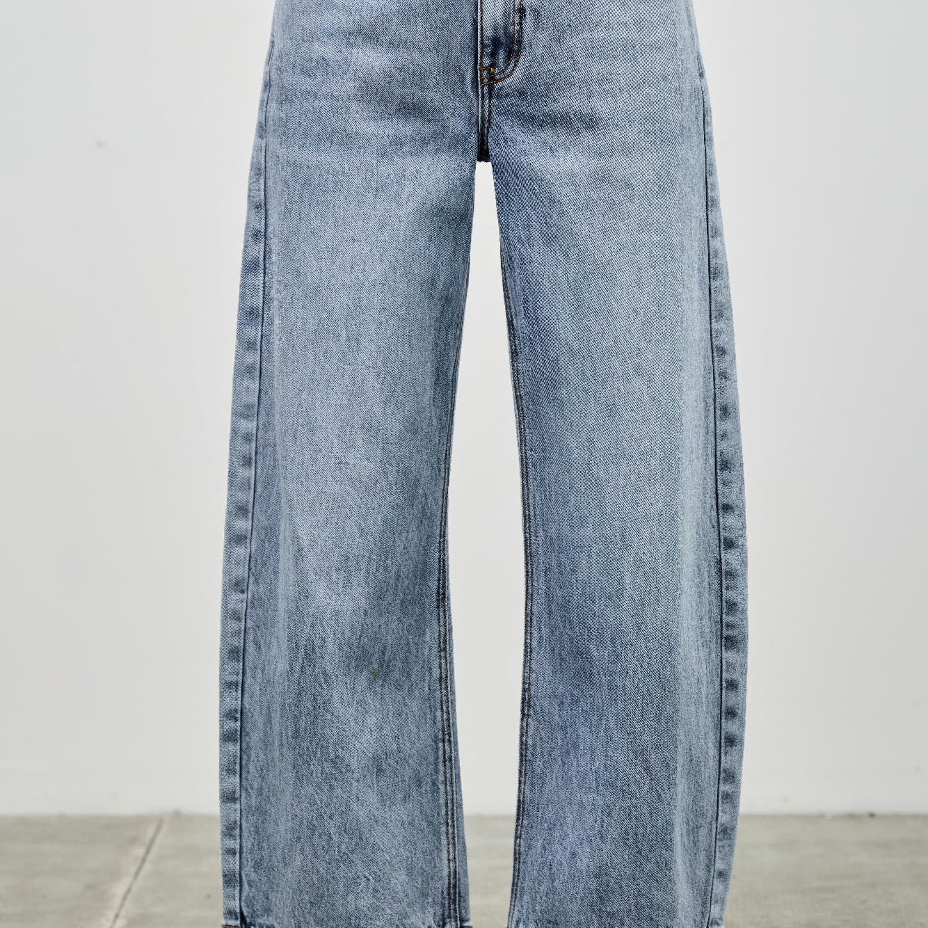 High Rise Low Curve Barrel jeans featuring a roomy barrel leg and high-rise waist in light blue denim.