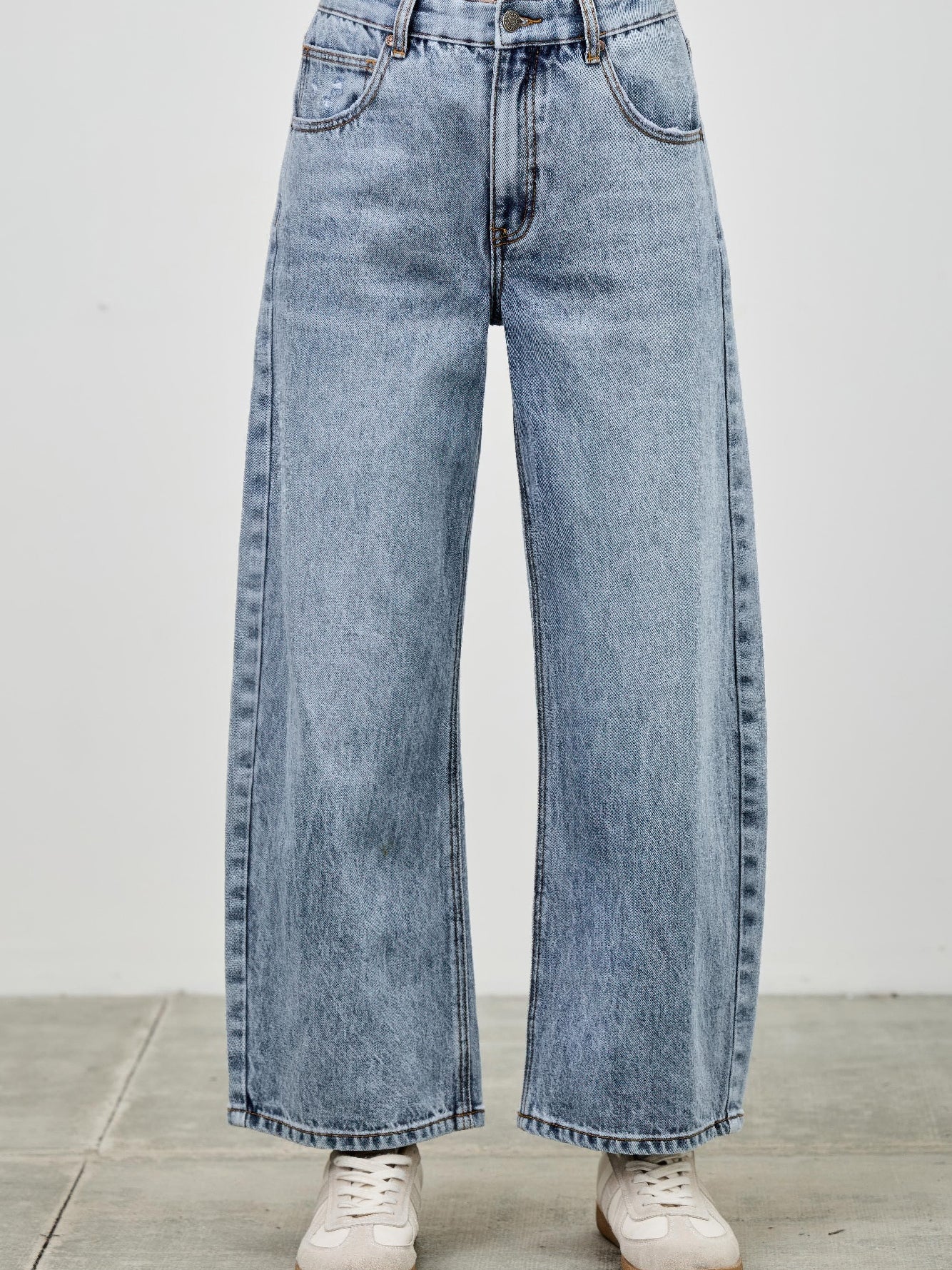 High Rise Low Curve Barrel jeans featuring a roomy barrel leg and high-rise waist in light blue denim.