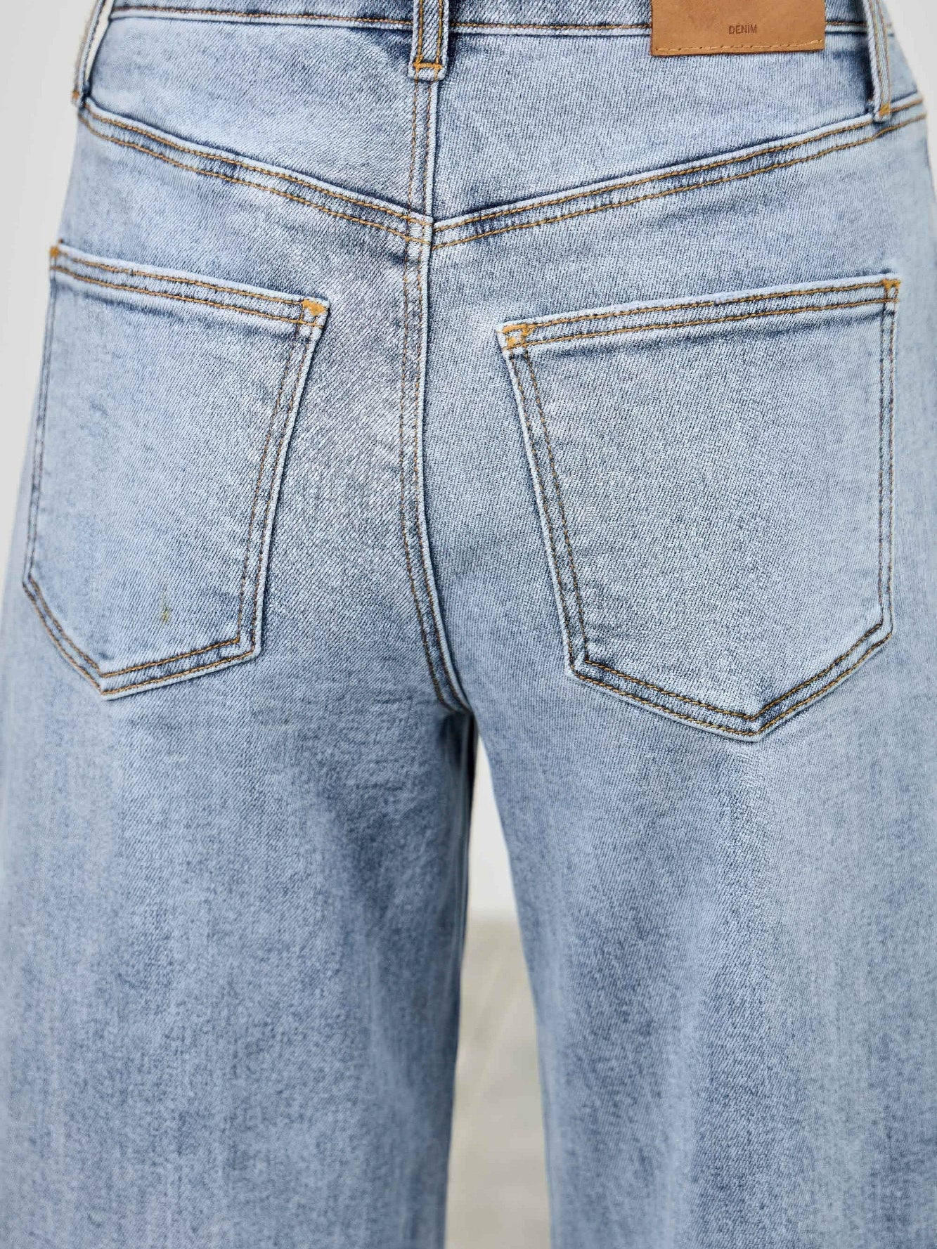 High Rise Low Curve Barrel jeans showcasing a back view with two pockets and a high-rise waist design.