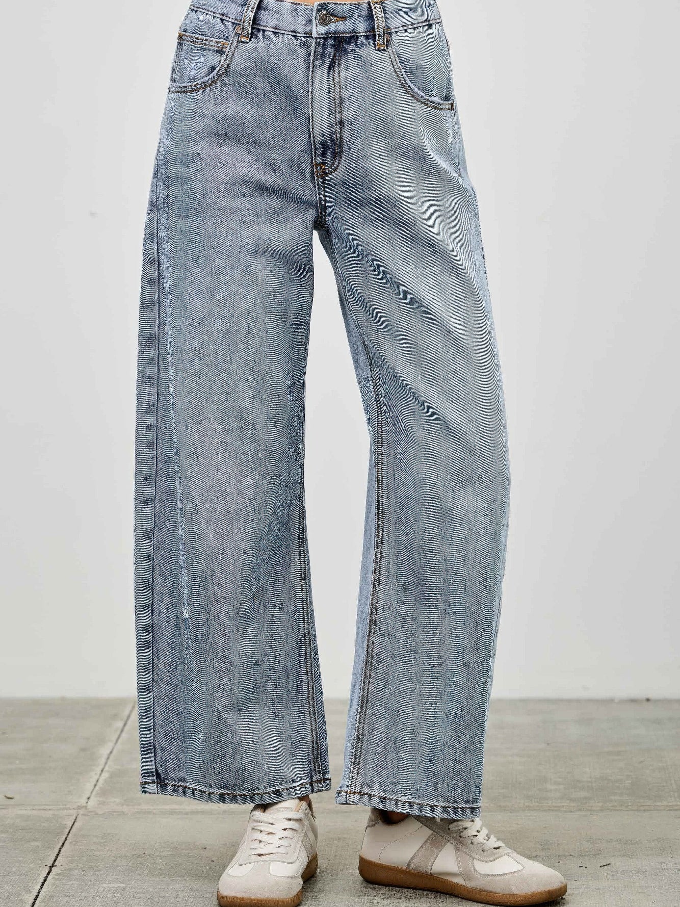 High Rise Low Curve Barrel jeans showcasing a modern silhouette and relaxed barrel leg design.