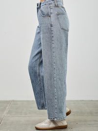 High Rise Low Curve Barrel jeans in light wash with a high-rise waist and roomy barrel leg profile.