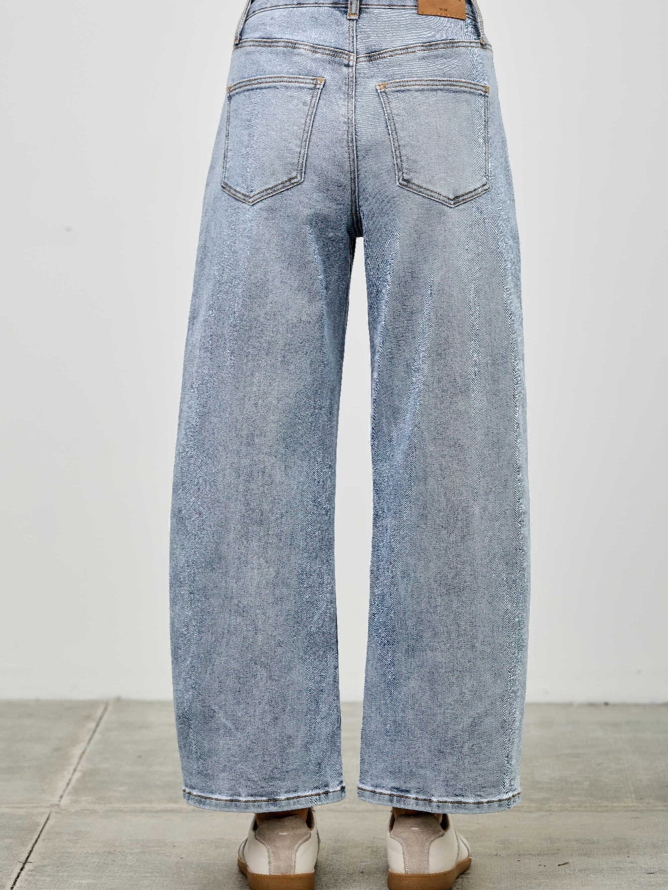 Back view of High Rise Low Curve Barrel jeans showcasing roomy barrel leg and high-rise waist.