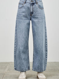 High Rise Low Curve Barrel jeans featuring a roomy barrel leg and high-rise waist for a modern stylish look.