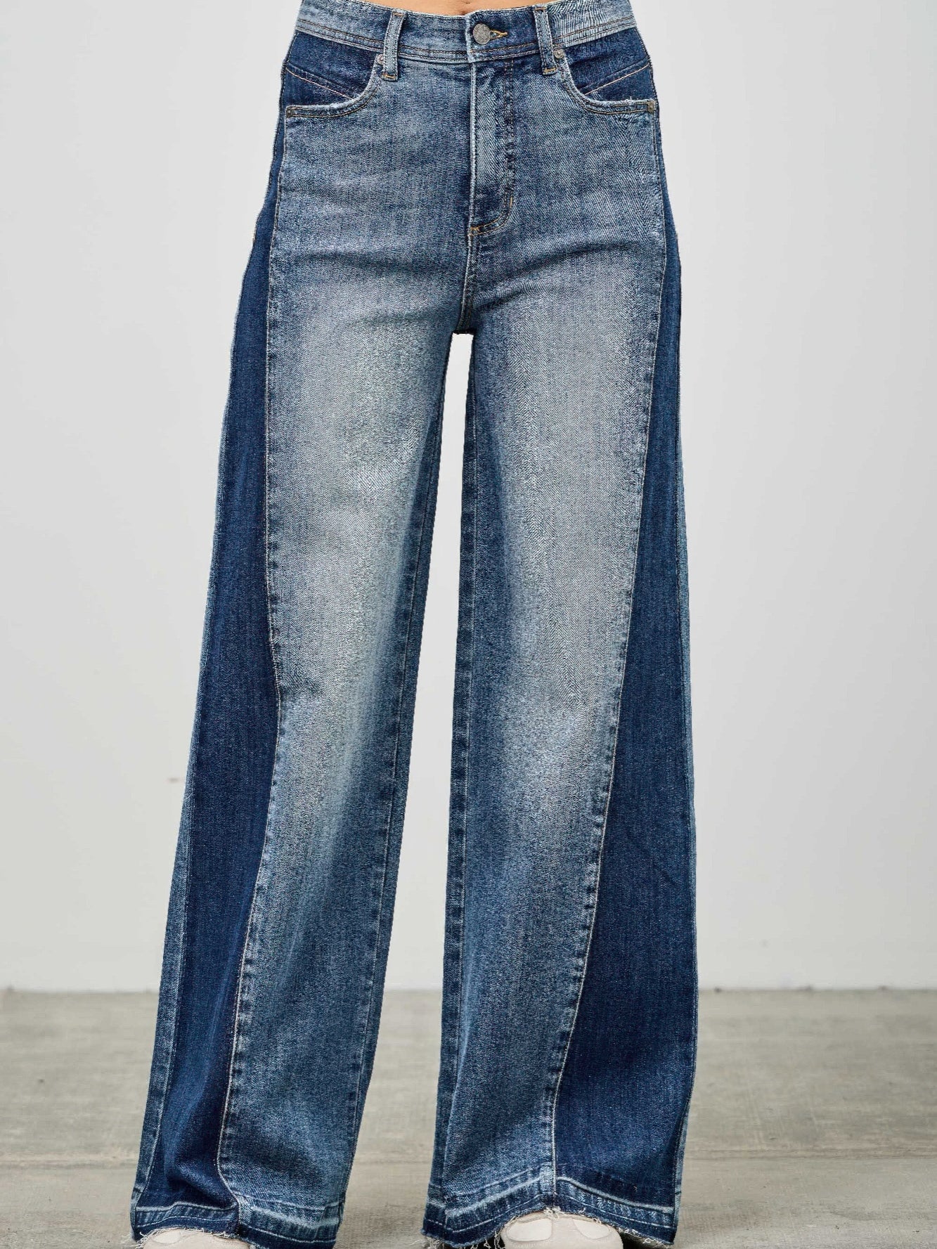 High Rise Wide Leg W/release Hem And Side Contrast featuring a stylish raw hem and side contrast paneling.