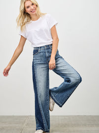 Model wearing High Rise Wide Leg W/release Hem And Side Contrast jeans with a white t-shirt, showcasing a stylish look.