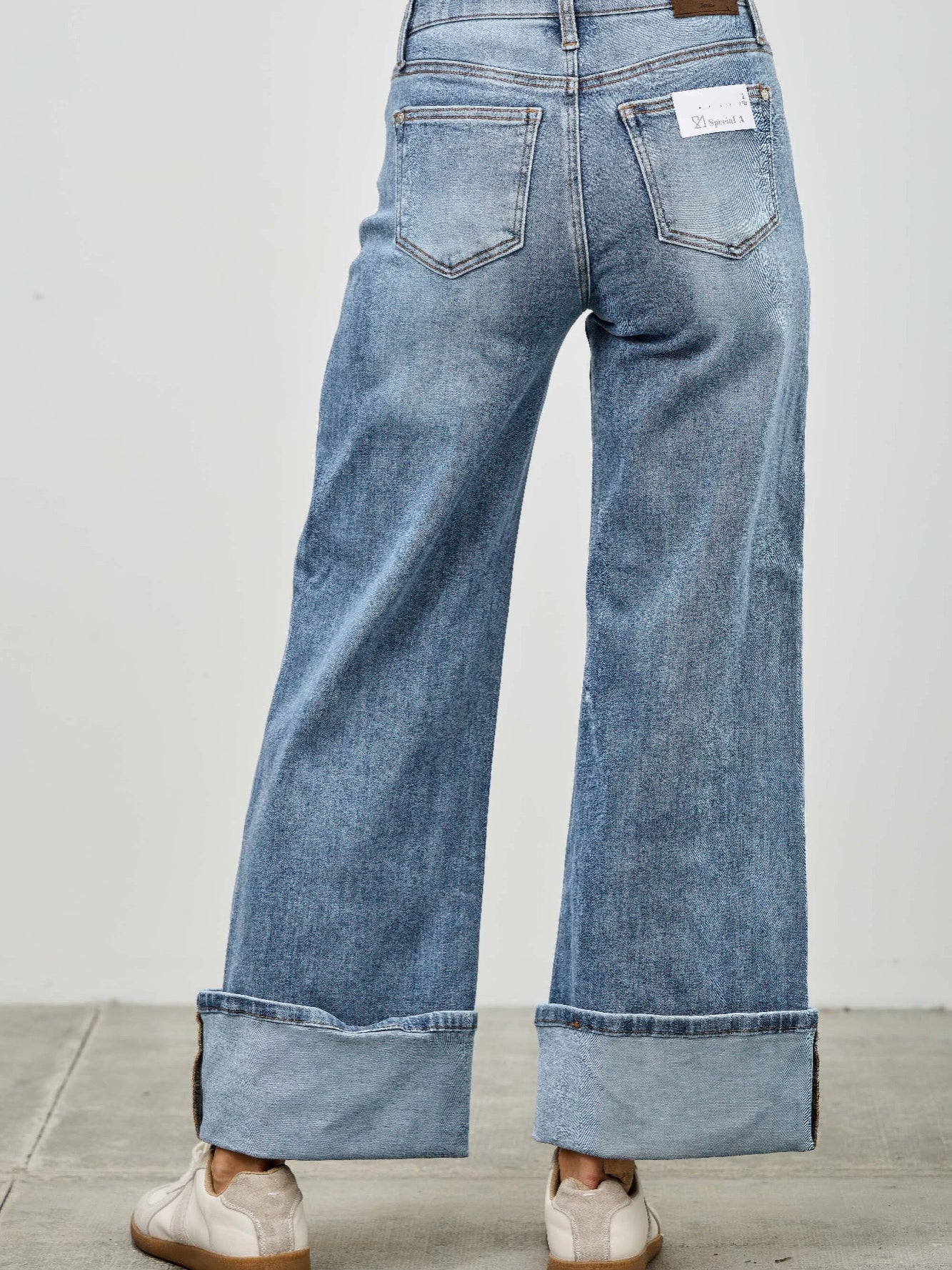 Mid Rise Cuffed Jeans With Stretch viewed from the back, showcasing the cuffed hem and relaxed fit.
