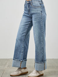 Mid Rise Cuffed Jeans With Stretch showcased on a model wearing casual sneakers.