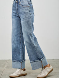 Mid Rise Cuffed Jeans With Stretch styled with casual sneakers, showcasing a polished look and comfortable fit.