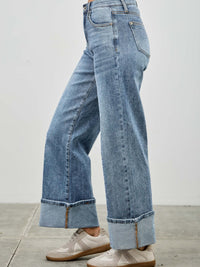 Mid Rise Cuffed Jeans With Stretch featured in casual styling with sneakers, showcasing their versatile and comfortable fit.