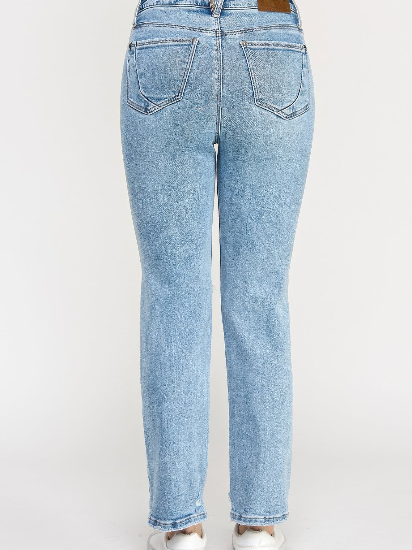 Back view of High Rise Button Fly Crop Slim Straight jeans in light blue wash.