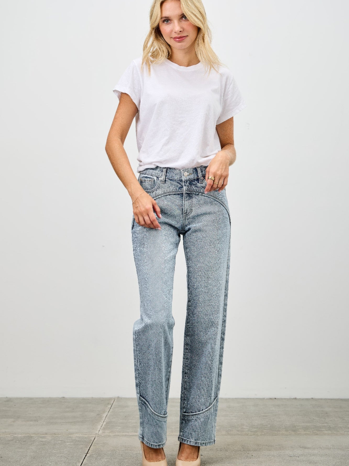 Model wearing Mid Rise Straight With Piping jeans, featuring a clean straight-leg cut and subtle piping detail.