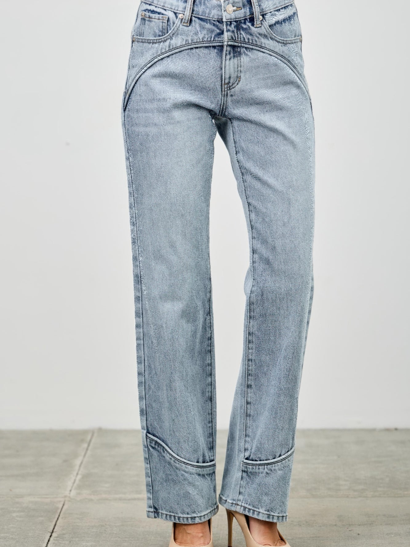 Mid Rise Straight With Piping jeans featuring subtle piping details along the seams in light wash denim.