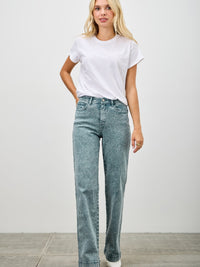 Model wearing High Rise Slim Wide Straight jeans with a white t-shirt, showcasing a modern silhouette and everyday comfort.