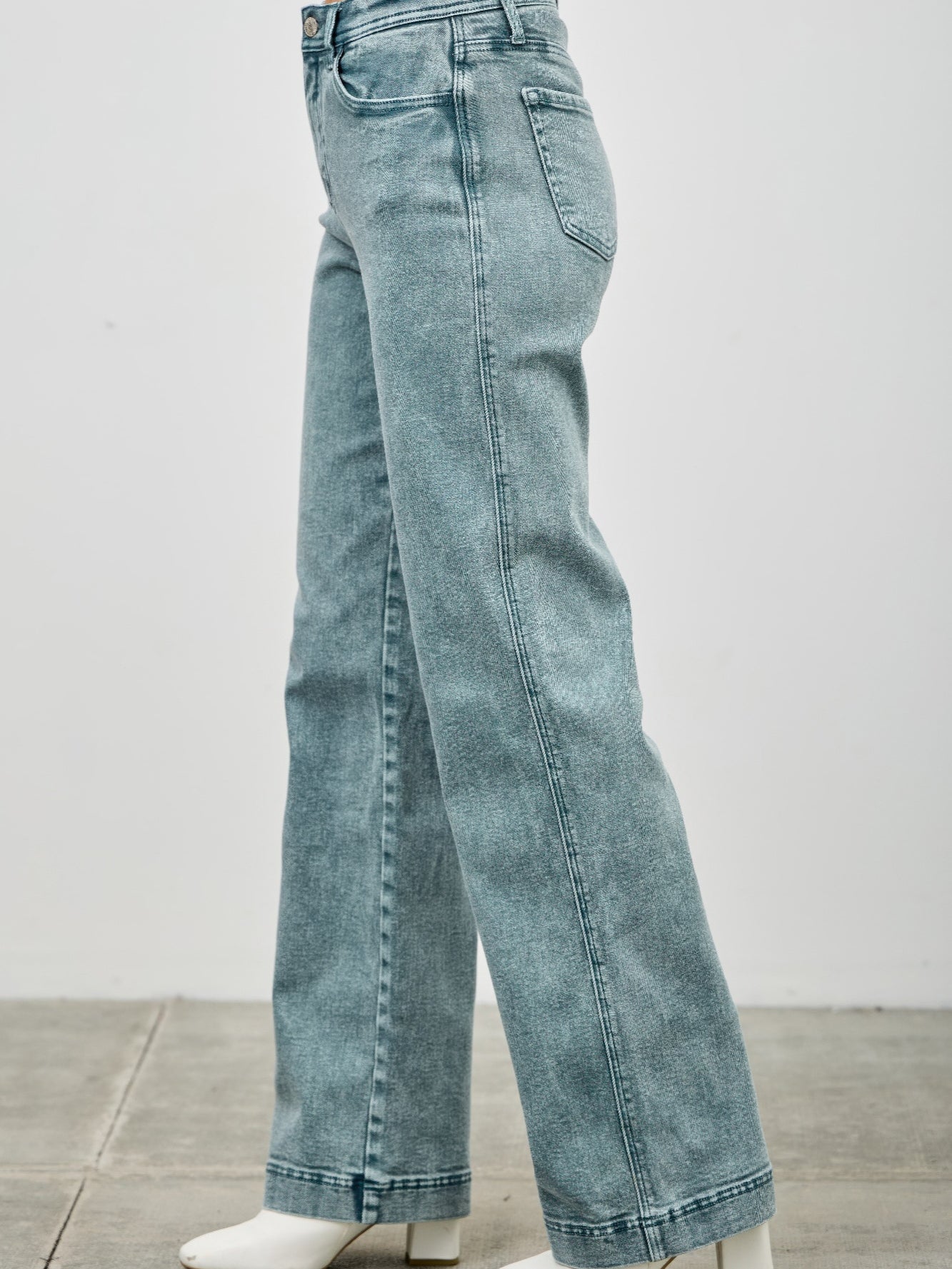High Rise Slim Wide Straight jeans showcasing a flattering high-rise waist and straight leg design.