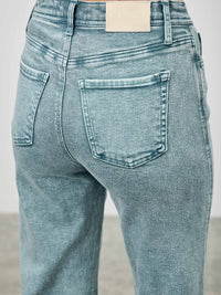 Back view of High Rise Slim Wide Straight jeans showcasing their flattering fit and modern design.
