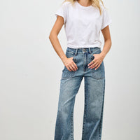 Model wearing High Rise Double Pocket Wide Leg jeans with a white t-shirt and relaxed fit pose.
