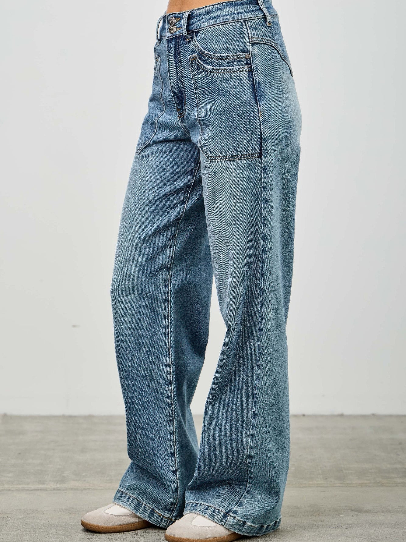 High Rise Double Pocket Wide Leg jeans featuring a wide leg silhouette and patched front pockets.