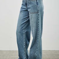 High Rise Double Pocket Wide Leg jeans featuring a wide leg silhouette and patched front pockets.