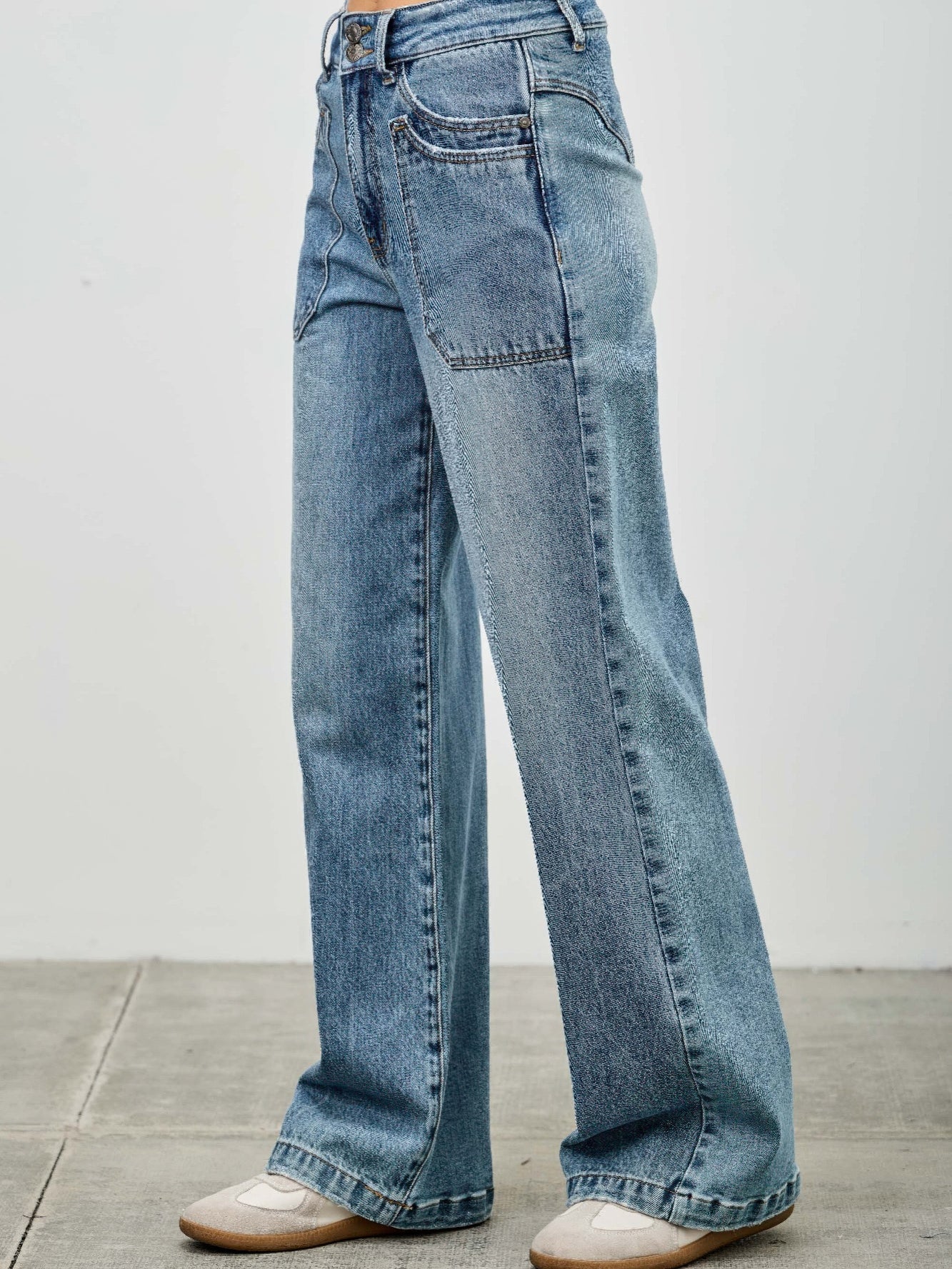 High Rise Double Pocket Wide Leg jeans displayed on model, showcasing a relaxed fit and stylish design.