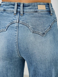 High Rise Double Pocket Wide Leg jeans showcasing the stylish back detail and flattering high-rise fit.