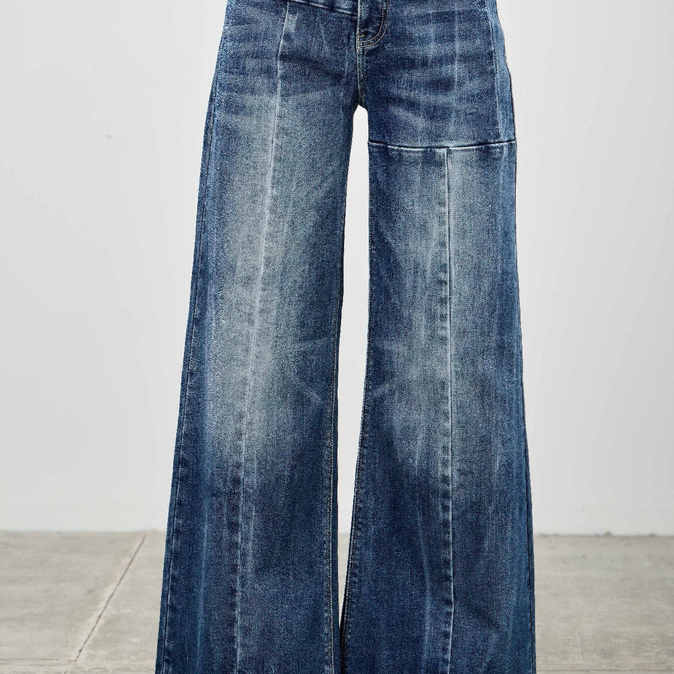 Mid Rise Wid Leg jeans showcasing a wide leg silhouette and relaxed fit, perfect for stylish and versatile outfits.