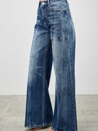 Mid Rise Wid Leg wide leg jeans in blue denim, featuring a relaxed fit and stylish silhouette.