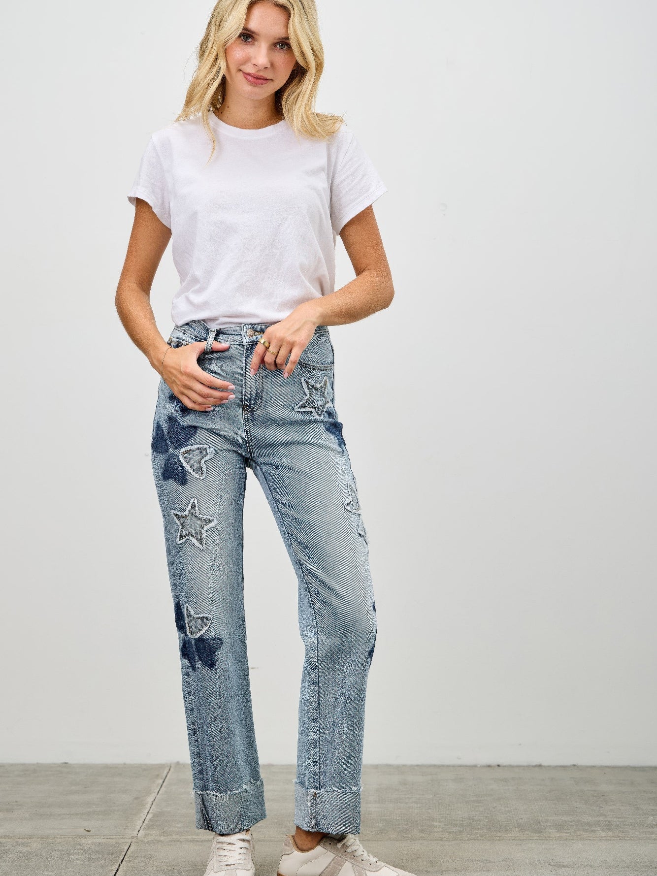 High Rise Star & Heart Patched Dad Jean W/stretch worn by a model with a white t-shirt in a casual setting.