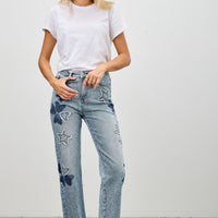 High Rise Star & Heart Patched Dad Jean W/stretch worn by a model with a white t-shirt in a casual setting.
