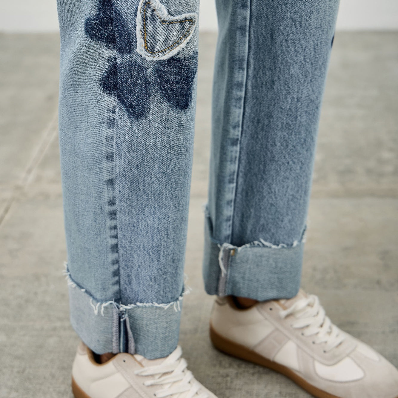 High Rise Star & Heart Patched Dad Jean W/stretch featuring playful heart and star patches on a light blue denim.