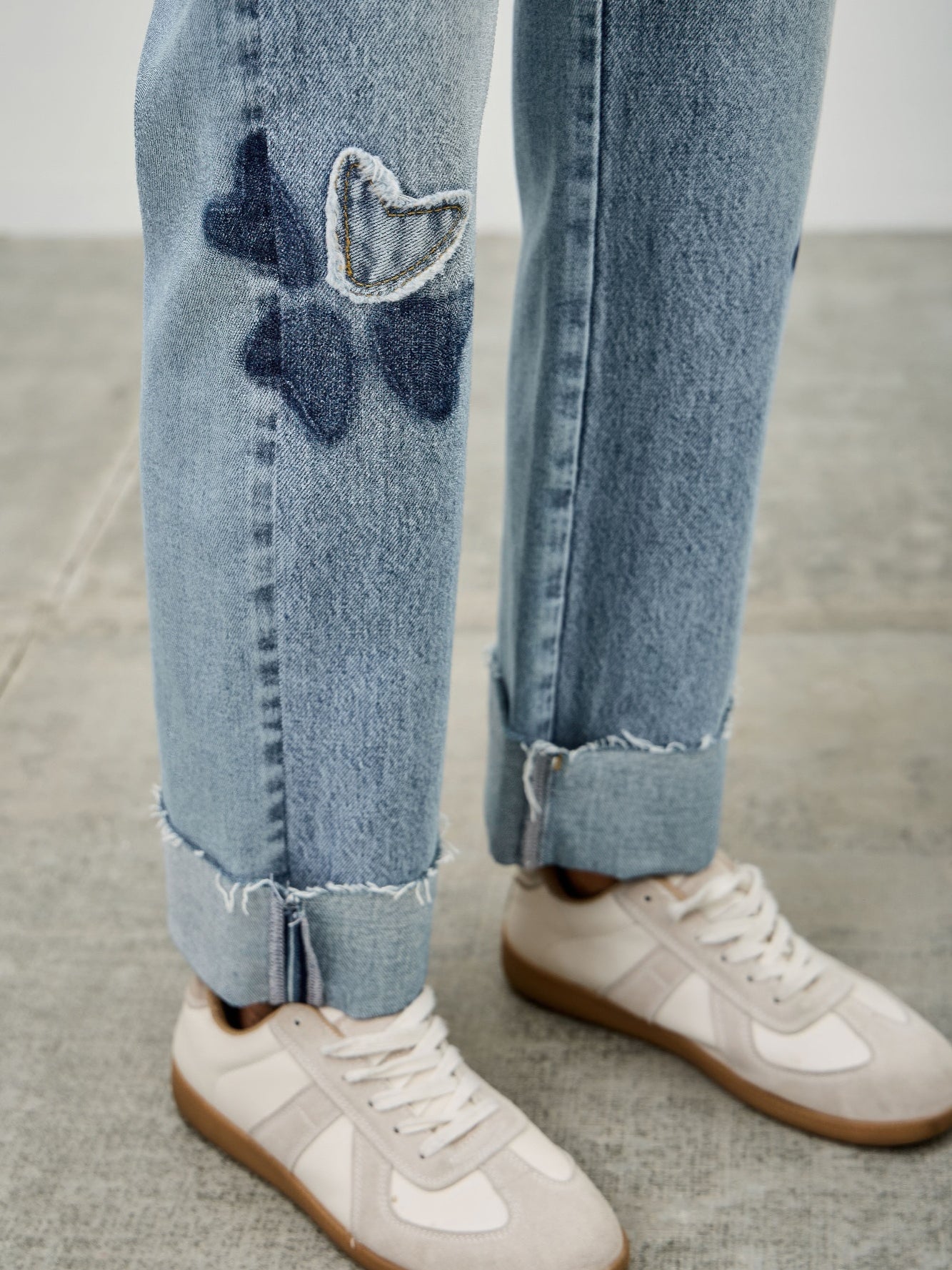 High Rise Star & Heart Patched Dad Jean W/stretch featuring playful heart and star patches on a light blue denim.