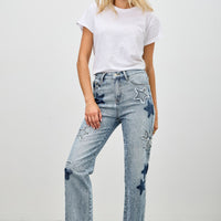 Model wearing High Rise Star & Heart Patched Dad Jean W/stretch with white t-shirt and casual shoes.