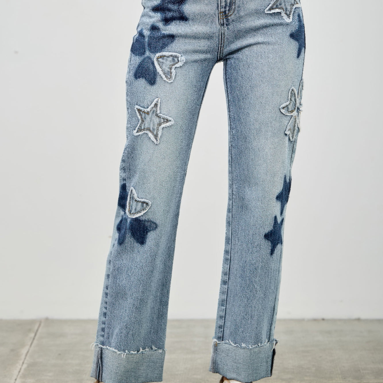 High Rise Star & Heart Patched Dad Jean W/stretch featuring playful star patchwork on light wash denim.
