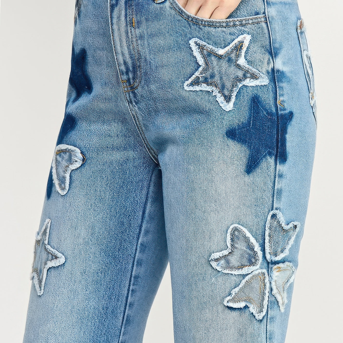 High Rise Star & Heart Patched Dad Jean W/stretch featuring playful star patchwork on light denim.