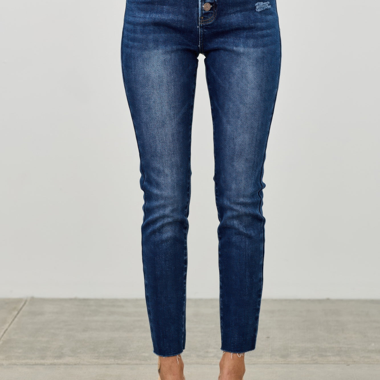 High Rise Ankle Skinny With Button Fly in blue denim, featuring a stylish button fly and ankle-length fit.