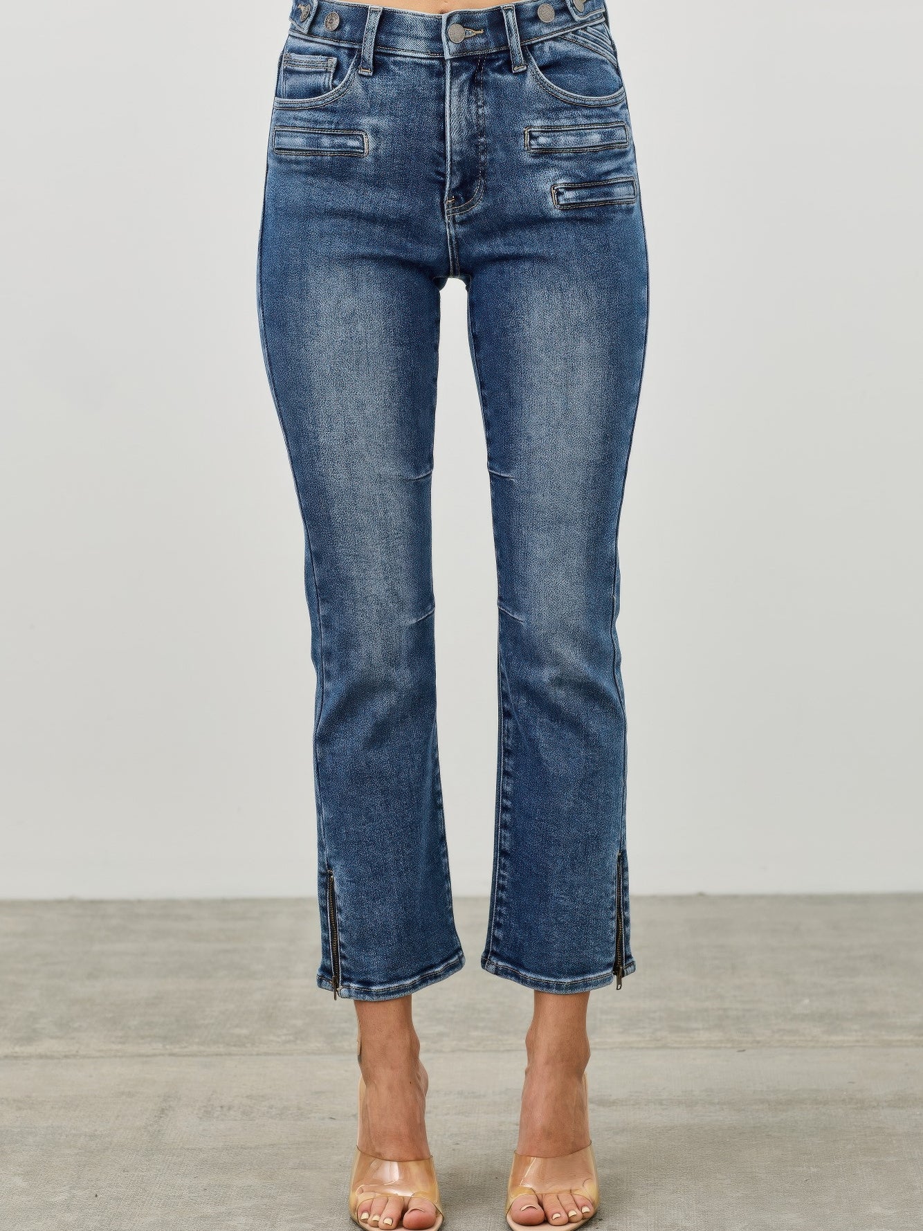 Mid Rise Skinny Crop Tummy Control jeans featuring a flattering fit and cropped length for a stylish look.
