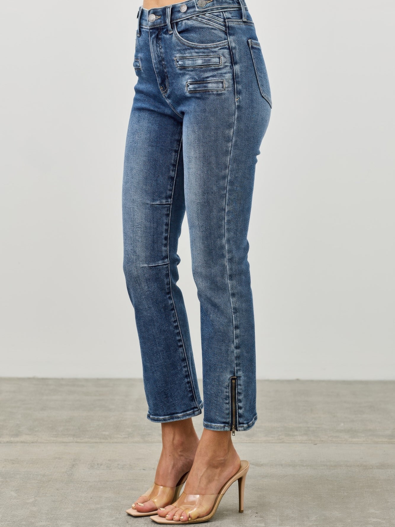 Mid Rise Skinny Crop Tummy Control jeans featuring a flattering fit and stylish cropped length.