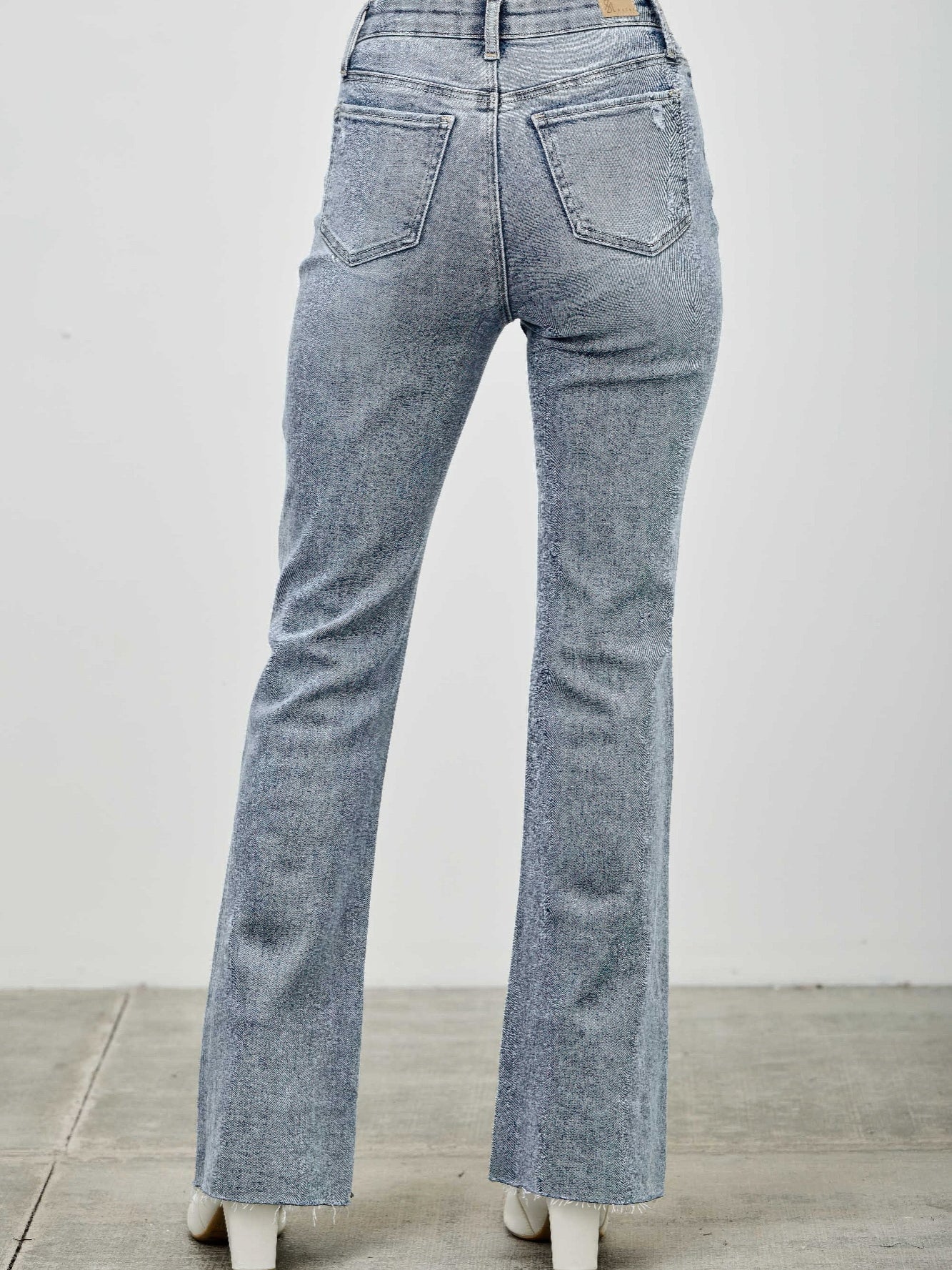 High Rise Kick Flare With Rhinestone back view showcasing the denim and flare hem design.